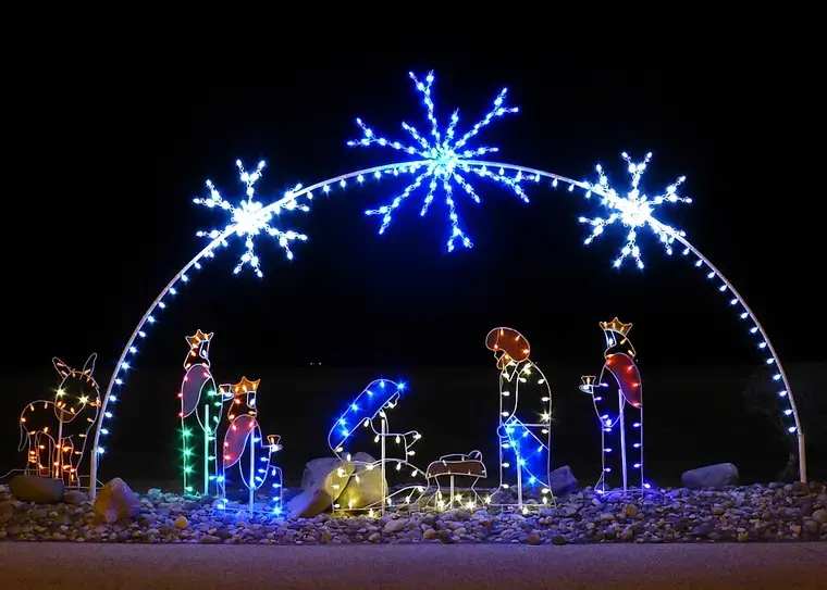 Depiction of the Nativity using Christmas lights. Removal of connective wires and piece of wood obscuring the creche …